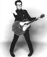 Elvis Costello, striking some sort of a pose.