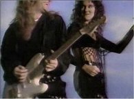 Dion's earlier singles and videos had a strong rock influence.