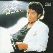 The original album cover to 1982's Thriller. The special edition cover features Jackson holding a tiger cub.
