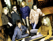  Standing: James Young, Chuck Panozzo, Ricky Phillips, Todd Sucherman. Sitting: Lawrence Gowan, Tommy Shaw.