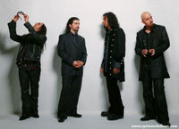 Photo of the band, from the official web site. From left to right: Daron Malakian, John Dolmayan, Serj Tankian, Shavo Odadjian