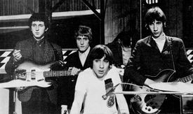 The Who on the television program Ready Steady Go! in 1965. Front: Keith Moon. Rear, left to right: John Entwistle, Roger Daltrey, Pete Townshend.